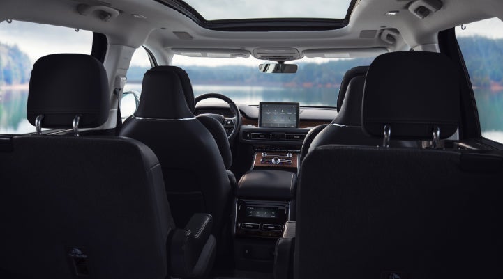 The interior of a 2024 Lincoln Aviator® SUV from behind the second row | Lincoln Demo 3 in Wooster OH