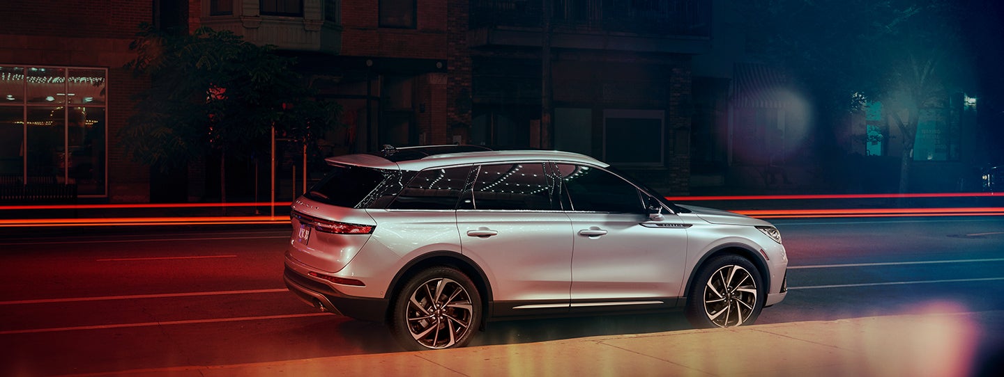 The 2024 Lincoln Corsair® SUV is parked on a city street at night. | Lincoln Demo 3 in Wooster OH