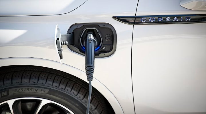 An electric charger is shown plugged into the charging port of a Lincoln Corsair® Grand Touring
model. | Lincoln Demo 3 in Wooster OH