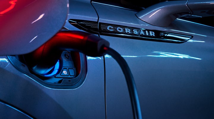 A charger plugged into the charging port of a 2024 Lincoln Corsair® Plug-in Hybrid model. | Lincoln Demo 3 in Wooster OH