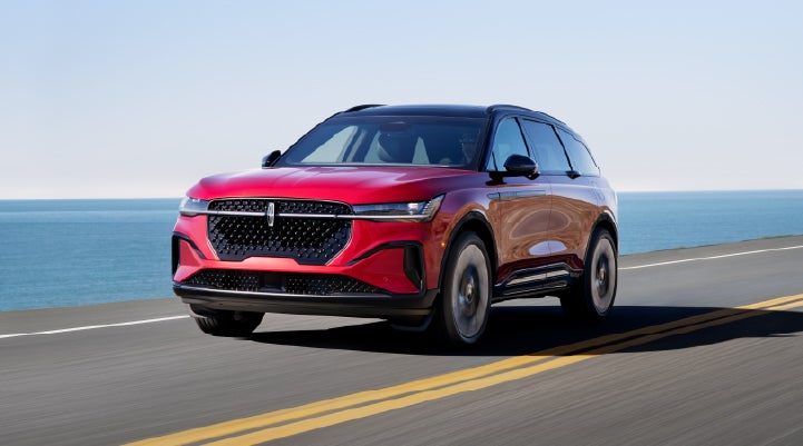 A 2026 Lincoln Nautilus® SUV is being driven on a seaside roadway. | Lincoln Demo 3 in Wooster OH